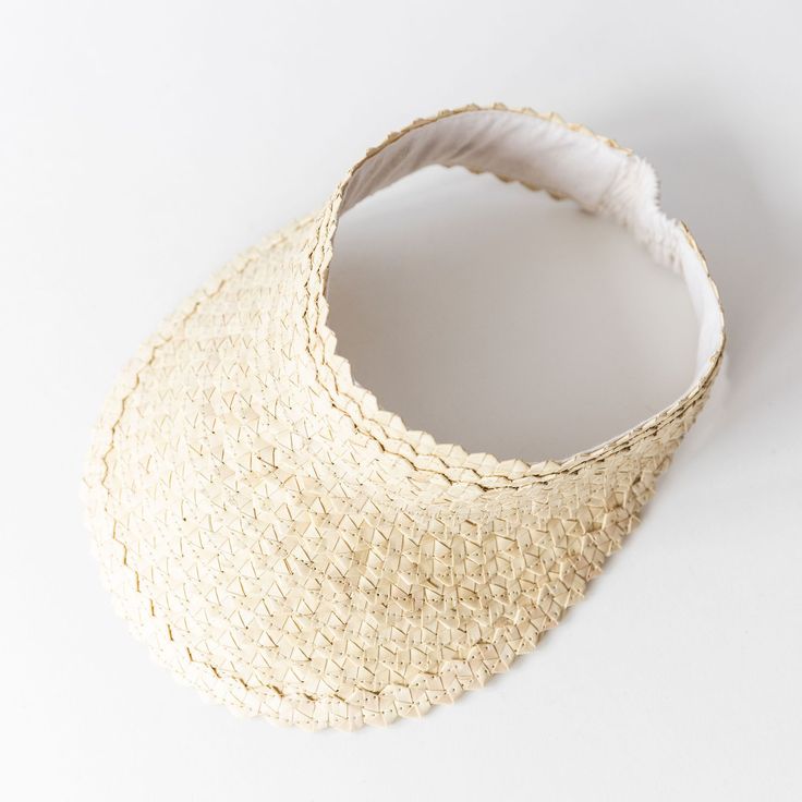 Keep the sun off your face this summer with a handwoven visor made by artisans in Bali! Great for beach or pool days with a braid or messy bun. Ethically made/Eco-friendly Made with palm leaves Elastic band One size fits most 11"x9" Lightweight Natural Straw Hat For Sunbathing, Adjustable Woven Straw Hat For Summer, Adjustable Jute Sun Hat For Summer, Natural Woven Sun Hat For Summer, Eco-friendly Woven Sun Hat For Spring, Bohemian Open Weave Sun Hat For Vacation, Eco-friendly Lightweight Straw Hat For Vacation, Adjustable White Straw Hat For Poolside, Adjustable Toquilla Straw Hat For Summer