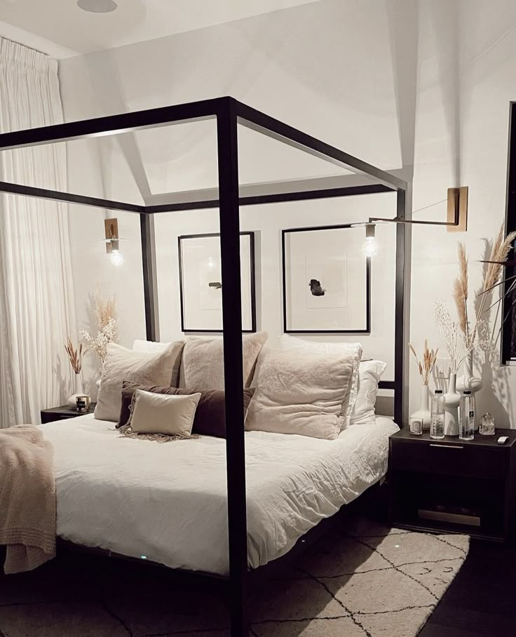 there is a bed with a canopy in the room