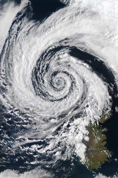 an image of a storm in the sky with clouds and water around it, as seen from space