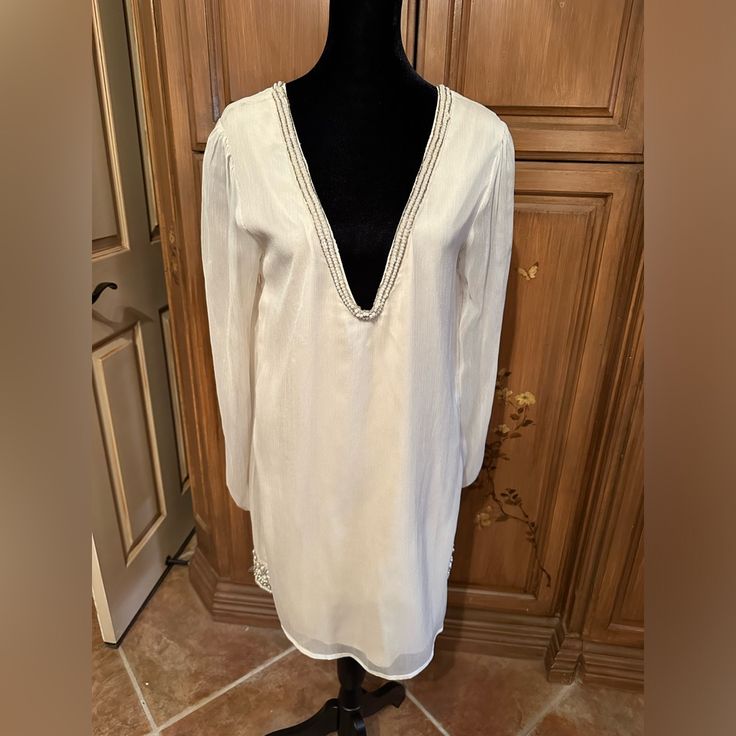 Never Worn Summer Long Sleeve Tunic For Brunch, Elegant Beach Tunic For Spring, Spring Tunic Mini Dress For Party, Fitted Tunic Mini Dress For Spring, Chic Fall Beach Tunic, Chic Beach Tunic For Fall, Fitted Tunic Dress For Day Out, Elegant Summer Tunic For Day Out, Elegant Tunic For Summer Day Out