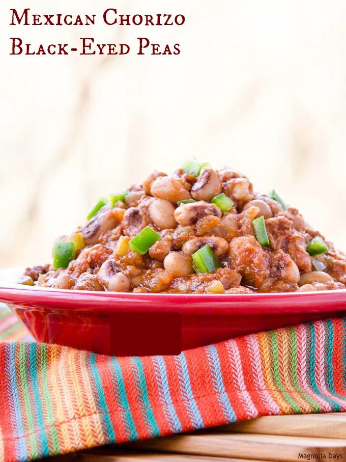 mexican chorizo black - eyed peas in a red bowl on a colorful towel