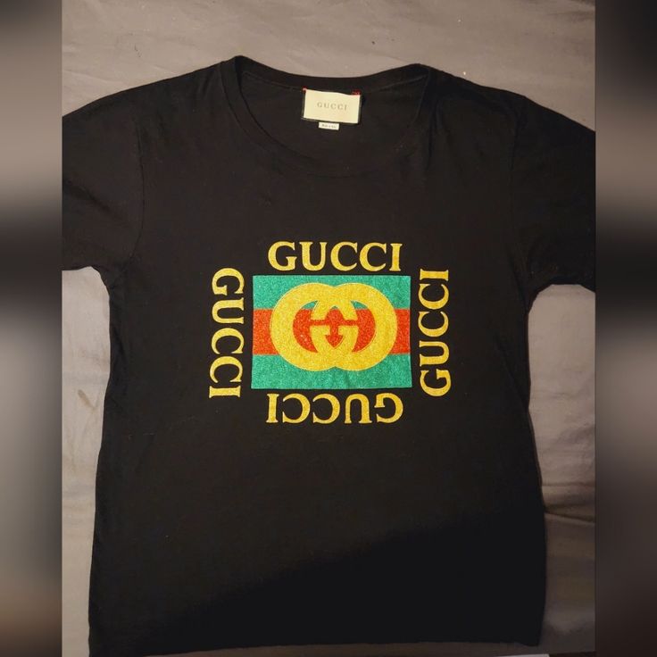 Authentic Gucci T-Shirt Glitter Letters . Fits A Small, Medium Or Large Because The Shirt Is A Stretch Material. Gucci Top, Gucci T Shirt, Glitter Letters, Gucci Black, The Shirt, Colorful Shirts, Tops & Tees, Womens Tops, Glitter