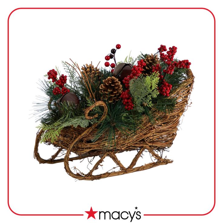 an old fashioned christmas sleigh with red flowers and greenery