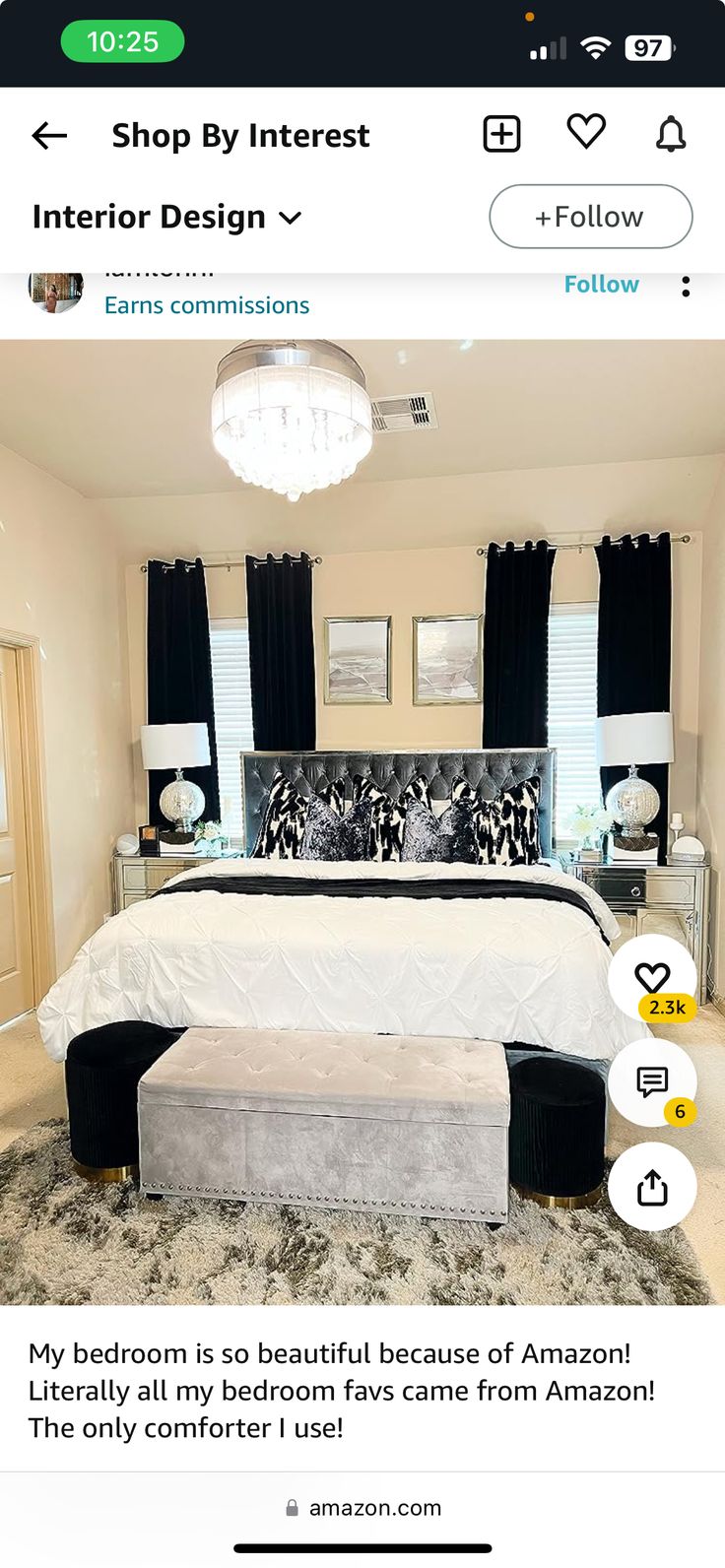 a bed room with a neatly made bed next to a black and white curtained window