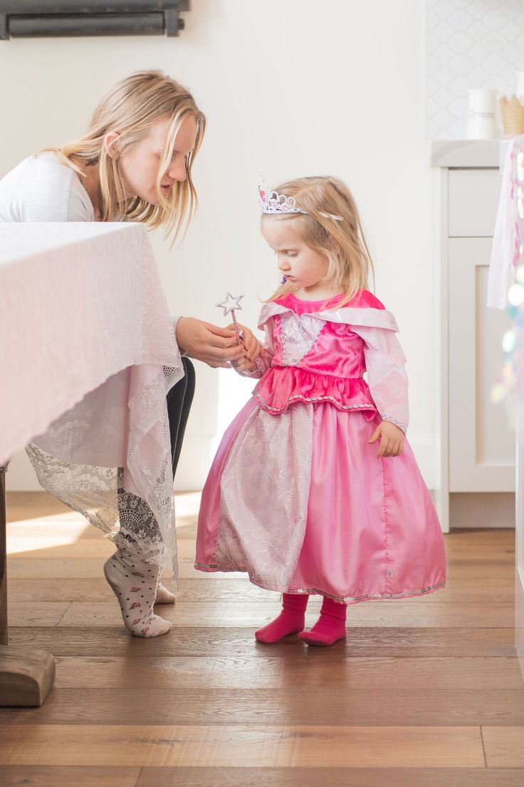 Awaken your little one's imagination when they slip on this dress and step into a fairy tale filled with romance and magical beings! Lovely two tone dress has a bright pink velvet bodice, complimented by light pink velvet sleeves Features a shimmery collar, silver trim, hot pink peplum Two tone china silk skirt skirt with silver swirl pattern printed on the inset Breathable, Silky Soft, 100% Polyester Fabrics Accessories Sold Separately **Size Small Does Not Include Gem ⚠️WARNING: CHOKING HAZARD Fairy Style Pink Princess Dress For Dress-up, Pink Fairytale Dress For Fancy Dress Occasions, Long Sleeve Princess Dress For Dress-up, Long Sleeve Pink Dress For Dress-up, Pink Fairytale Princess Dress For Party, Pink Fairytale Dress For Dress-up, Pink Princess Fairy Dress For Costume Party, Pink Princess Long Sleeve Tutu Dress, Pink Long Sleeve Princess Tutu Dress