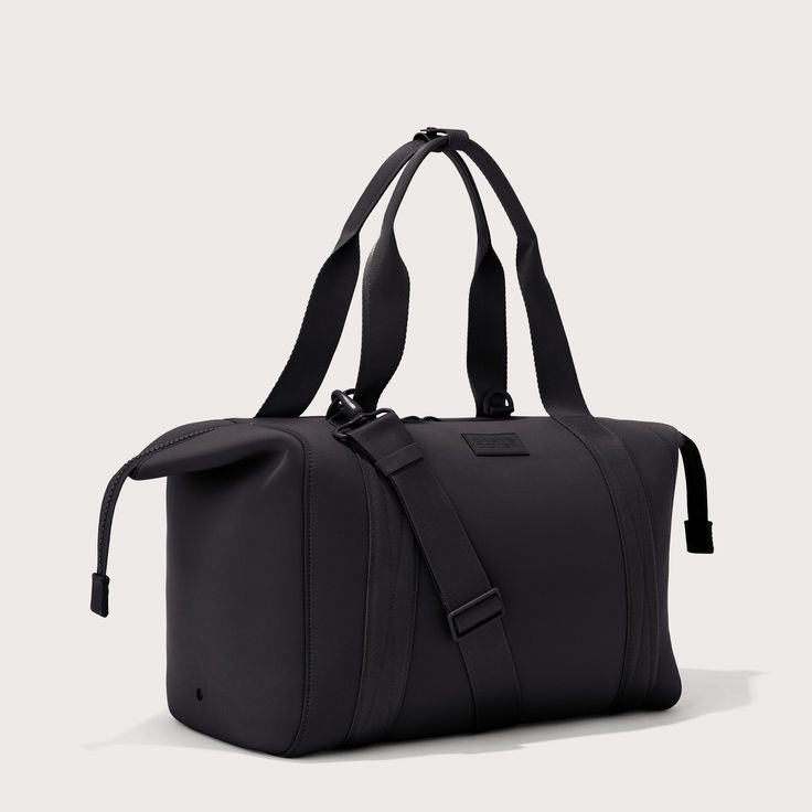 The weekend is nigh and youre ready for a much-needed getaway. Whether youre off to commune with nature in a cabin by the woods or jetting to Paris for a stylish urban excursion, our large Landon Carryall has you covered. This lightweight bag is designed to support you on any journey, modest or immense, and unsnaps at the sides to create more room for any unexpected finds you cant leave behind. It also includes a padded laptop sleeve, an air mesh pouch for all your essentials and a water bottle Functional Satchel For Overnight Trips, Modern Bags With Leather Handles For Trips, Functional Satchel Travel Bag For Overnight Trips, Modern Luggage With Leather Handles For Trips, Functional Duffle Bag For Overnight Trips, Functional Shoulder Duffle Bag For Overnight Trips, Practical Bags With Adjustable Strap For Overnight Trips, Practical Rectangular Weekender Bag For Overnight Trips, Functional Shoulder Weekender Bag For Overnight Trips