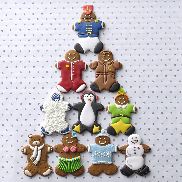 decorated cookies arranged in the shape of a christmas tree