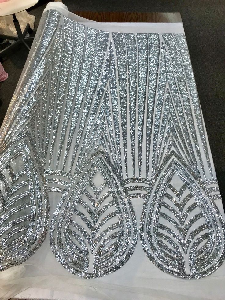 silver sequins on white sheer fabric