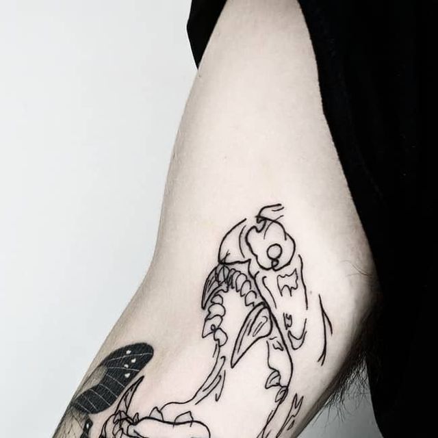 a person with a tattoo on their arm