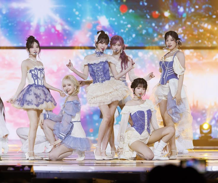 girls'generation performing on stage at an event