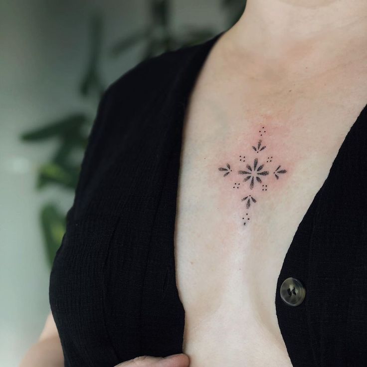 a woman with a tattoo on her chest