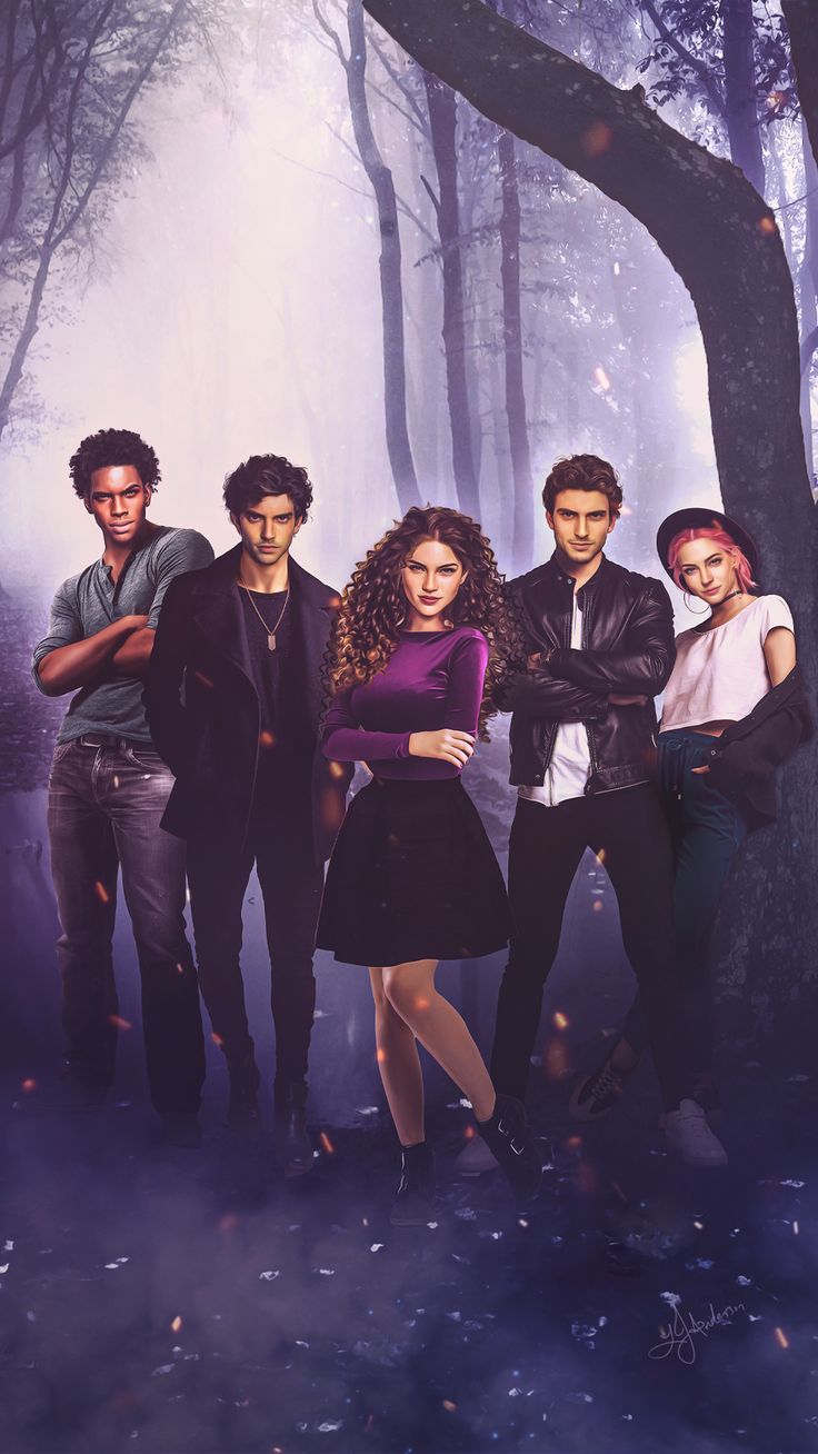 the cast of riverdale standing in front of a forest filled with trees and leaves