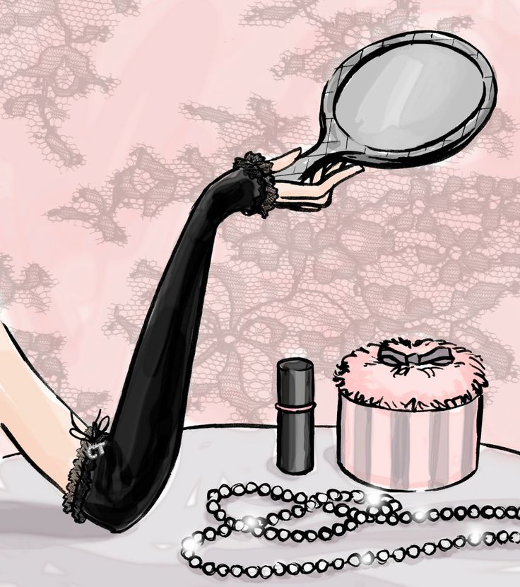 a woman's hand holding a magnifying glass over a cake