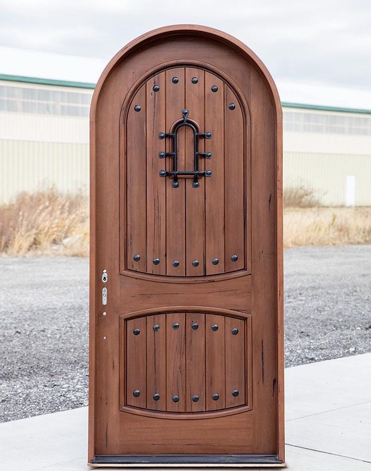 a large wooden door on the side of a building