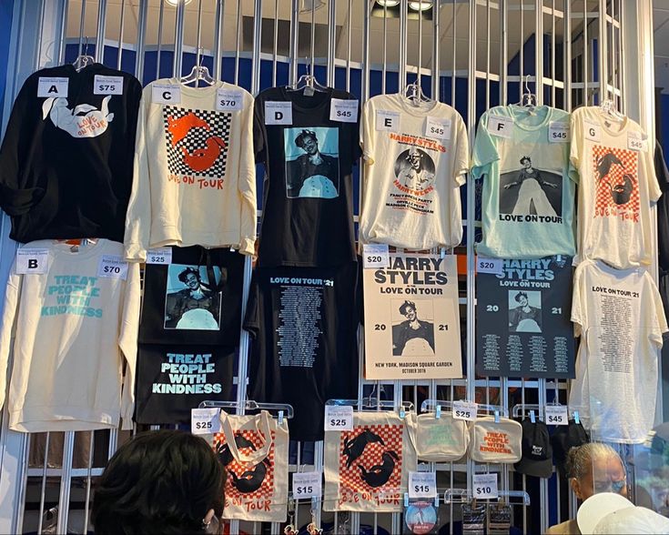 there are many t - shirts on display in the store