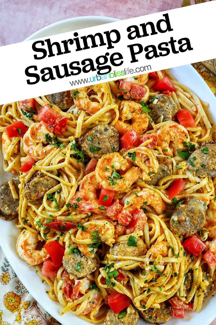 shrimp and sausage pasta on a white plate with text overlay that reads shrimp and sausage pasta