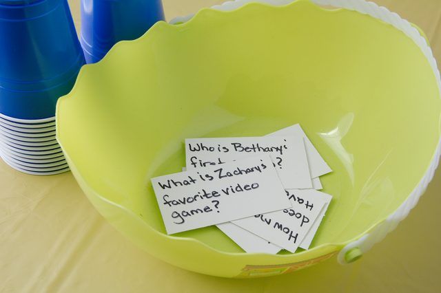 there are several pieces of paper in the bowl with words on it that read who is birthday first?