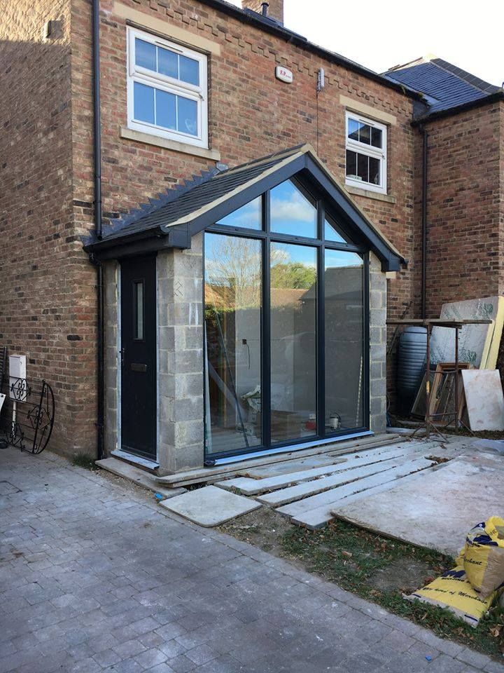 a brick building with glass doors and windows