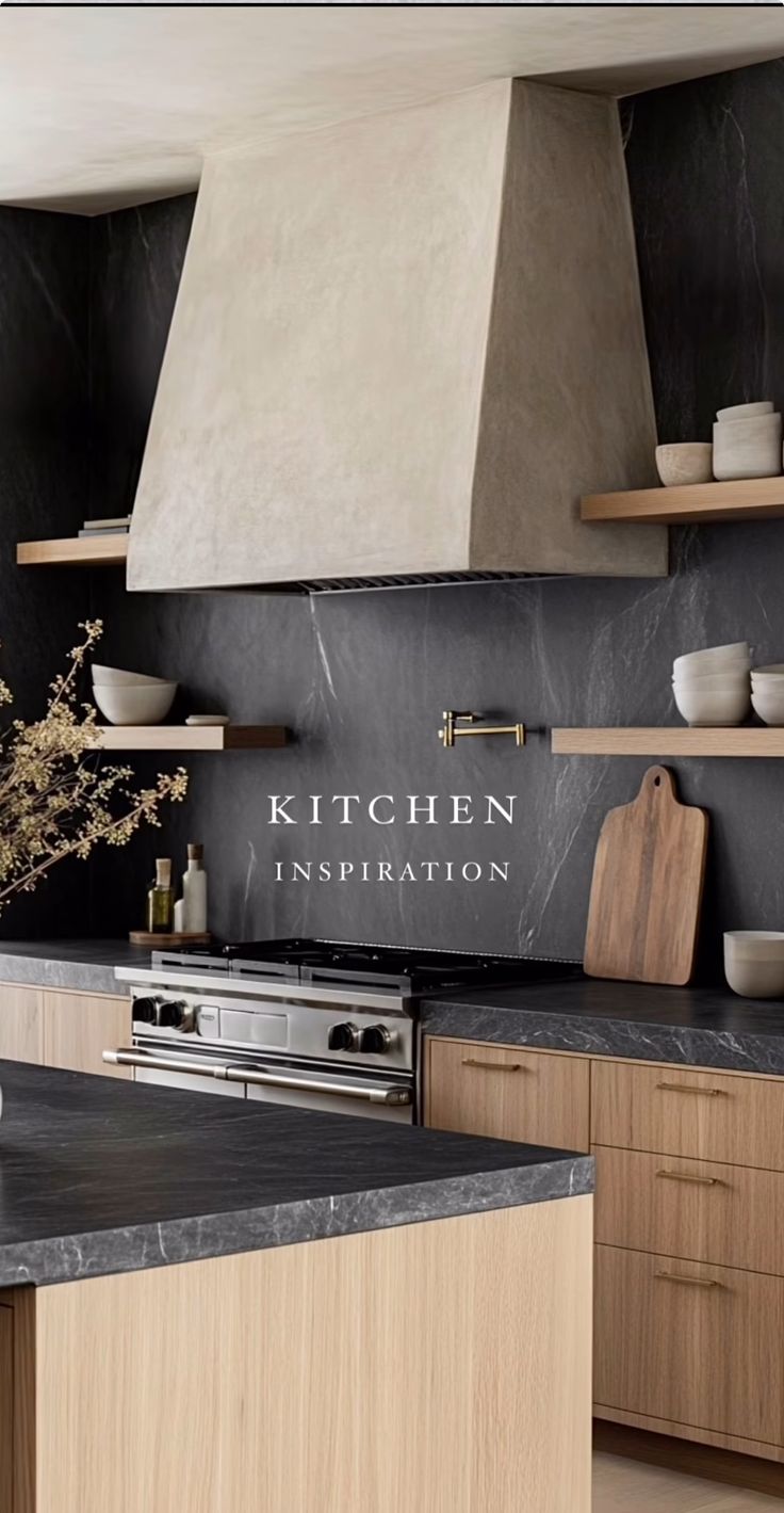 a kitchen with black counter tops and wooden cabinets in front of an oven hood that reads kitchen inspiration