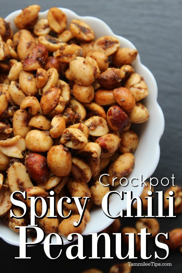 spicy chili peanuts in a white bowl with the words crackpot spicy chilli peanuts