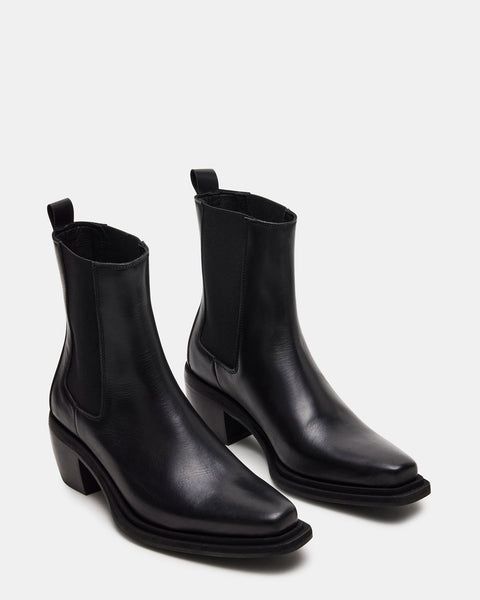 Step out in style with our METRO bootie. Featuring a sleek square toe and chic ankle boot design, this everyday chelsea boot is the epitome of sophistication. Crafted with a gore stretch for added comfort, it's the perfect combination of fashion and function. 2.25 inch heel height 9.5 inch shaft circumference 6 inch sh Black Chelsea Boots Outfit, Women Chelsea Boots, Boots For Women Ankle, Chelsea Boots Outfit, Black Leather Chelsea Boots, Boot Design, Women's Booties, Heeled Chelsea Boots, Chelsea Boots Women