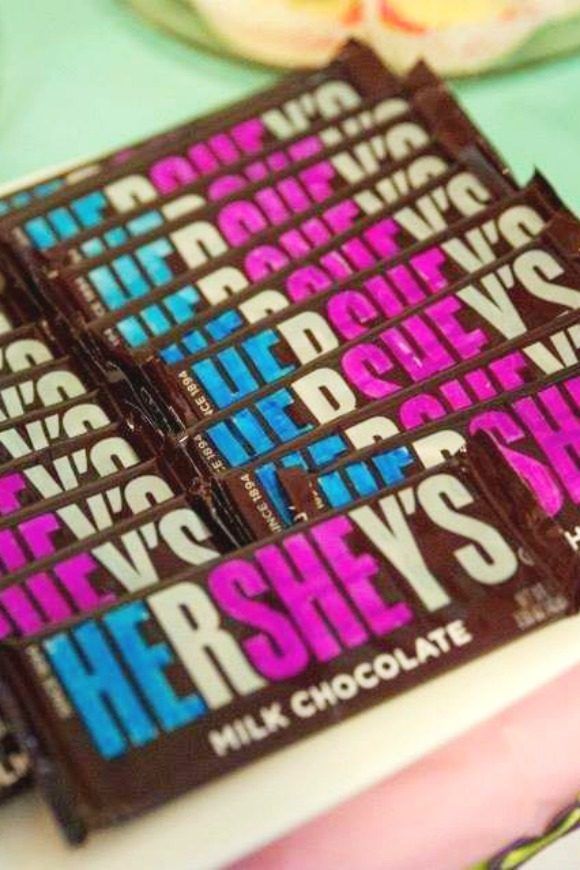 chocolate bar with pink and blue lettering on it