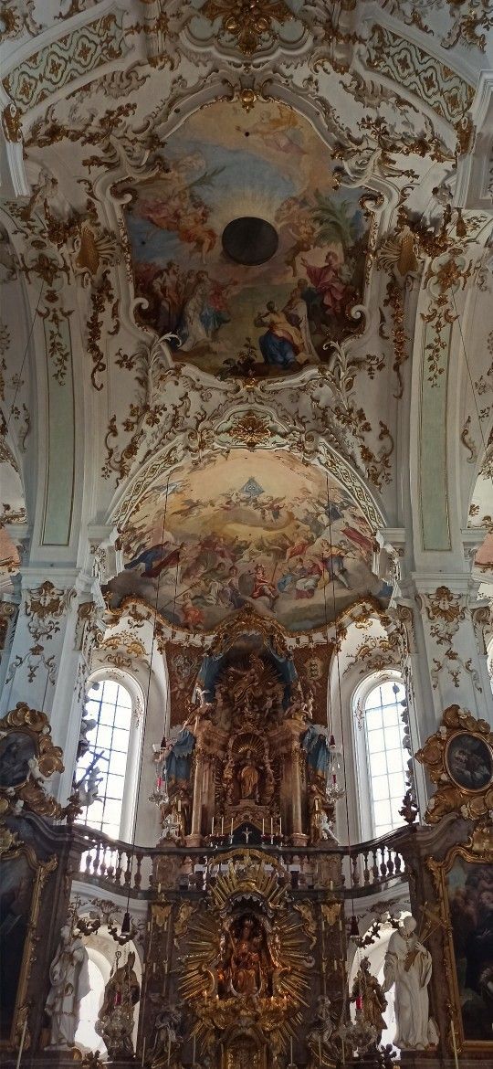 an ornately decorated church with high ceilings