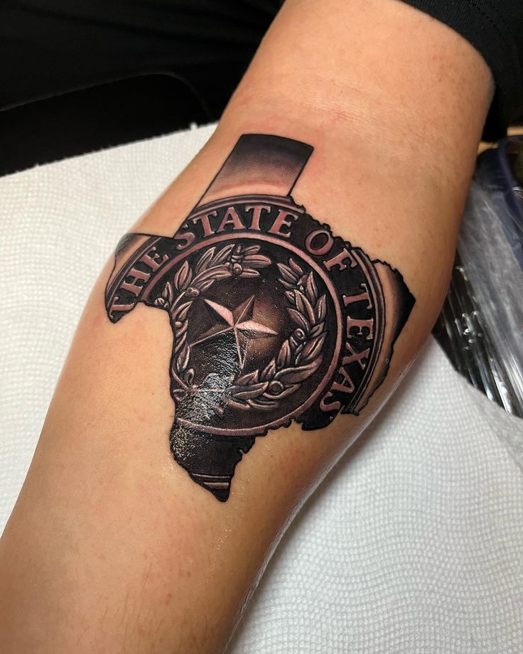 a person with a tattoo on their arm that says, the state of texas is