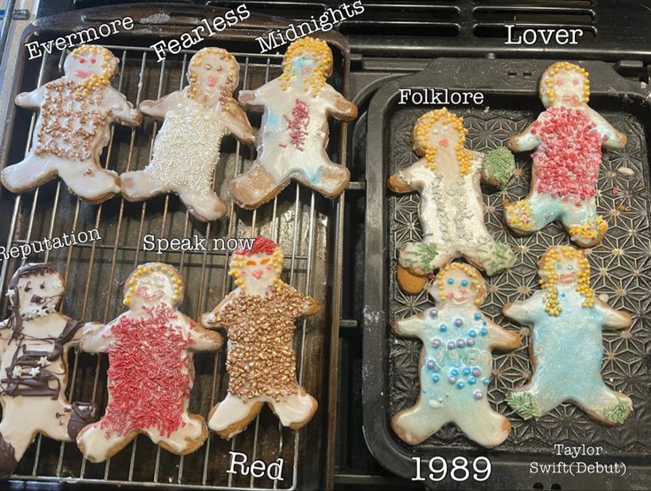 10 Gingerbread men decorated differently across two baking trays (6 on the left in two rows of 3, 4 on the right in two rows of 2). Each gingerbread man is a different Taylor swift album. Taylor Swift Gingerbread, Eras Tour Sleepover, Swiftie Sleepover Ideas, Taylor Swift Birthday Sleepover Ideas, Taylor Swift Birthday Party Ideas Sleepover, Taylor Swift Tent Sleepover, Taylor Swift Slumber Party, Taylor Swift Sleepover Ideas, Taylor Swift Sleepover