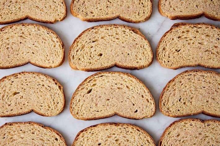 several slices of bread are arranged on a table