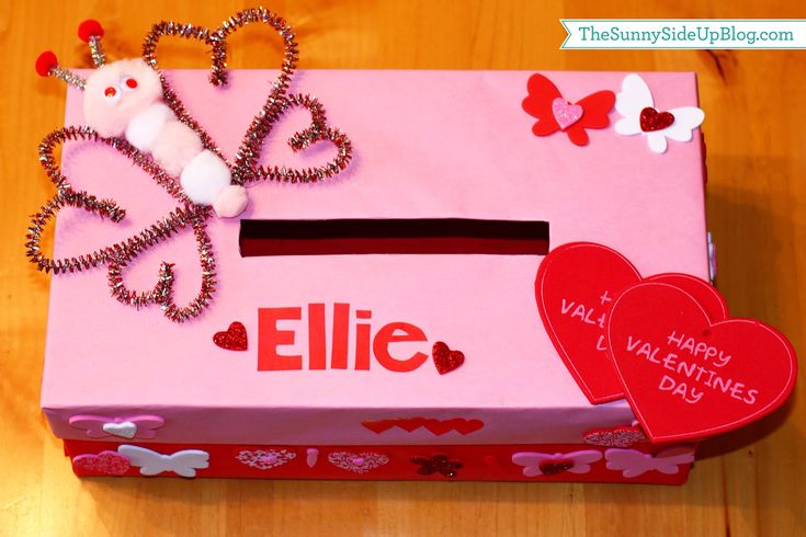 a pink valentine's day box with hearts on it