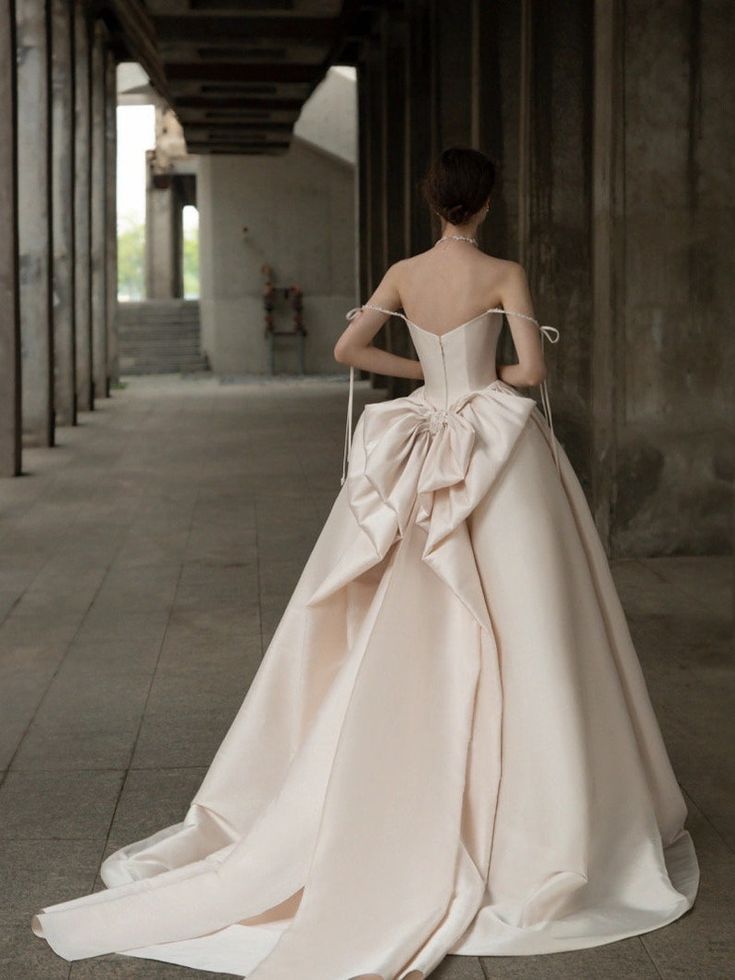 the back of a woman in a wedding dress