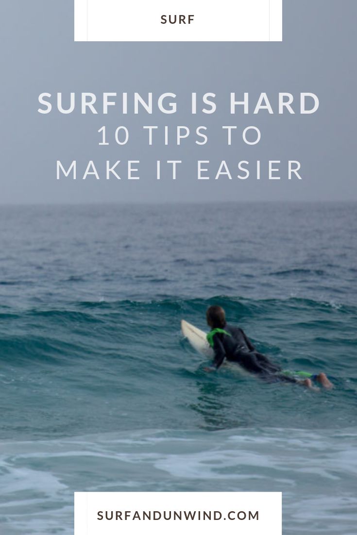 a man riding a surfboard on top of a wave in the ocean with text reading surfing is hard 10 tips to make it easier