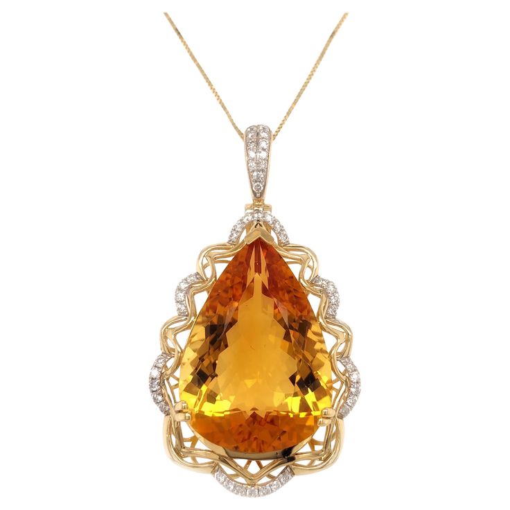 Stunning citrine diamond pendant. High brilliance, golden honey tone, transparent clean, pear shape faceted, natural 21.84 carats citrine mounted on high profile open basket with 4 bead prongs and knife prong, accented with round brilliant cut diamonds. Handcrafted design set in 14 karats yellow gold with 10 karats, 16 inches long box chain with spring clasp. Citrine: 21.84 carats, high brilliance, golden honey tone, pear shape Diamond: 0.40 carat, round brilliant cut Color: G-H Clarity: SI1 - S Ruby Diamond Necklace, Ruby Diamond Pendant, Pink Diamond Earrings, Sapphire Diamond Necklace, 1st Dibs, Cocktail Earrings, Golden Honey, Fancy Yellow Diamond, Tanzanite Diamond