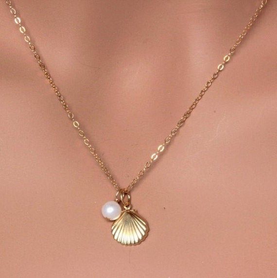 "Tiny 14k Gold Fill Starfish with pearl Necklace It could be Sterling silver as well. This necklace use for Everyday and cute. It make of ... -14k Gold Fill starfish and -4-6mm freshwater pearl, -14k gold fill cable chain with spring claw. -it come with small ribbon jewelry box and -One set of Care instruction package. -It could be 925 Sterling Silver as well. Total length will be 16\" or 18\"or 20\" MORE SEA CHARM NECKLACE https://www.etsy.com/shop/rainbowearring1/search?search_query=sea+charm& Gold Ocean Necklace, Ocean-inspired 14k Gold Jewelry, Elegant Starfish Charm Necklace For Beach, Dainty Round Jewelry For Beach, Elegant Beach Jewelry With Pearl Pendant, Starfish Charm Strand Jewelry For Gift, Starfish Charm Strand Jewelry Gift, Elegant Starfish Charm Jewelry For Gifts, Elegant Starfish Charm Jewelry As Gift