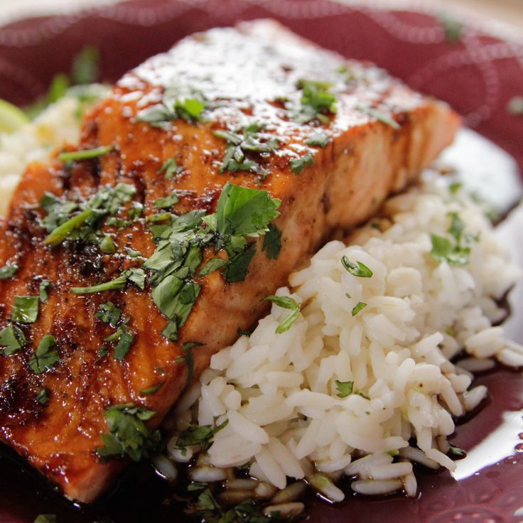 a plate with rice and salmon on it