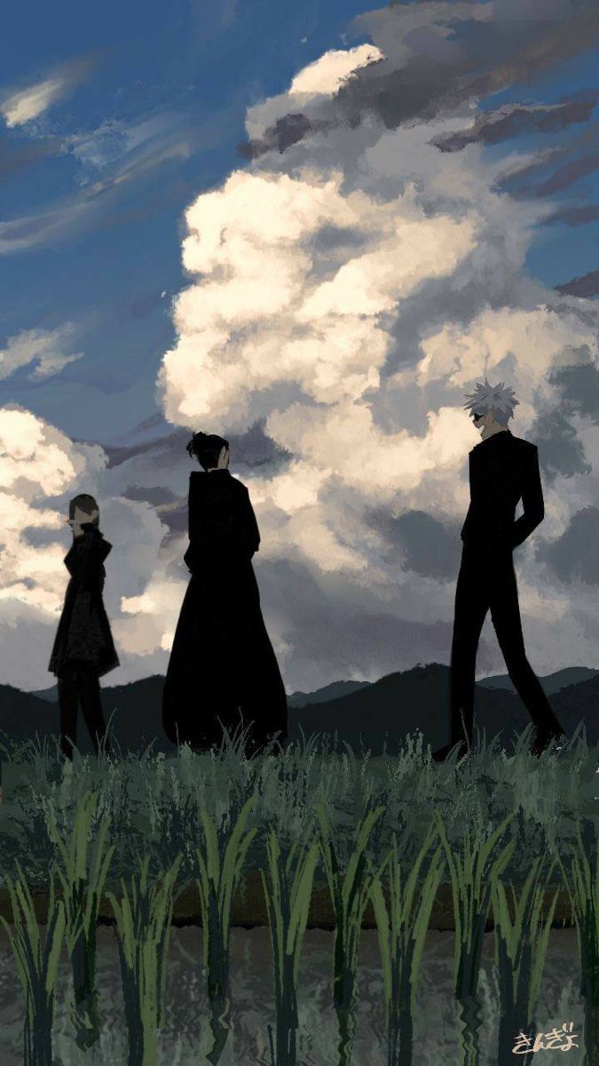 three people standing in the grass looking at clouds