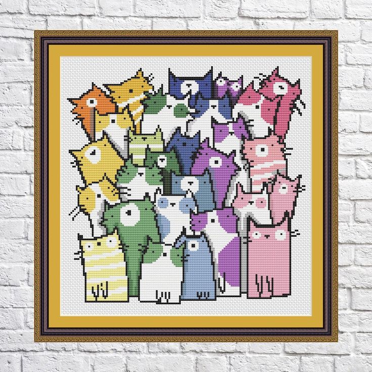 a cross stitch pattern with many cats in different colors and sizes, on a white brick wall