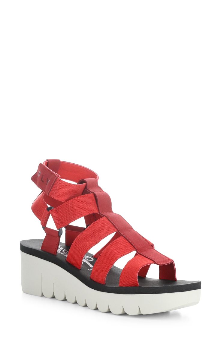 Take your casual look up a notch with this strappy sandal grounded by a lightly cushioned footbed and wedge heel. 2 1/2" heel; 1" platform Adjustable ankle strap with hook-and-loop closure Cushioned footbed Synthetic and leather upper/textile lining/rubber sole Made in Portugal Red Platform Sandals, Comfy Sandals, Fly London, Suede Wedges, Platform Wedge Sandals, Platform Wedges, Strappy Sandals, Wedge Heels, Platform Sandals