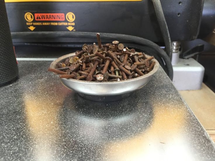 a metal bowl filled with lots of clumps sitting on top of a counter