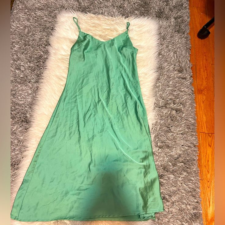 Size:S Brand New This Elegant Sage Green Slip Dress Is Perfect For Any Occasion. The Satin Material Drapes Beautifully And Feels Luxurious Against The Skin. Dress It Up With Heels Or Keep It Casual With Sandals. Sage Green Color Satin Material Slip Dress Style Versatile For Any Occasion Comfortable And Flowy Fit Sage Green Slip Dress, Green Satin Slip Dress, Slip Dress Style, Green Slip Dress, Skin Dress, Sage Green Color, Satin Slip Dress, Satin Slip, Green Satin