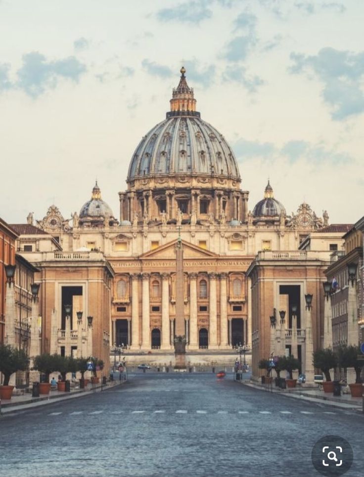 an old building with a dome in the middle