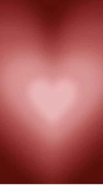 a blurry red background with a heart shape