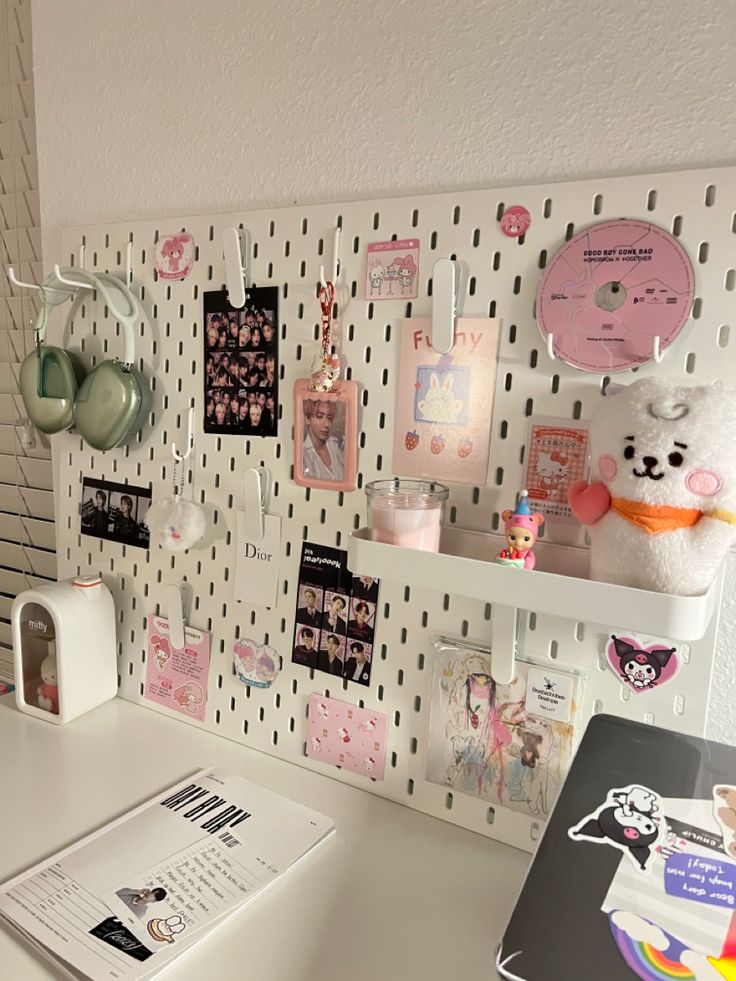 a white desk topped with lots of magnets and pictures