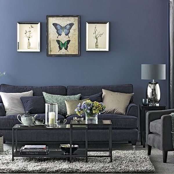 a living room with blue walls and furniture