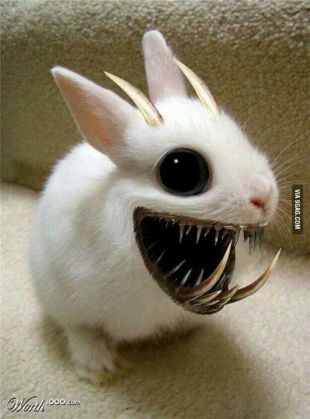 a small white rabbit with large metal spikes on its head and teeth in it's mouth