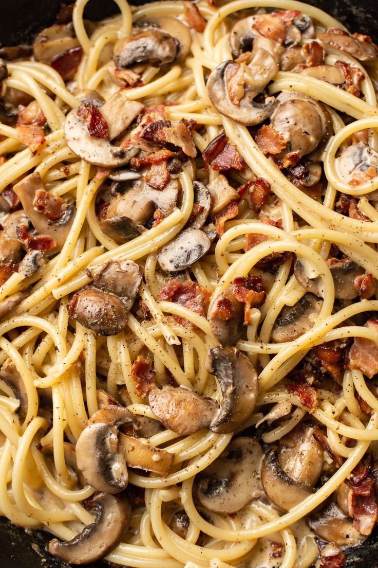 pasta with mushrooms and bacon in a skillet