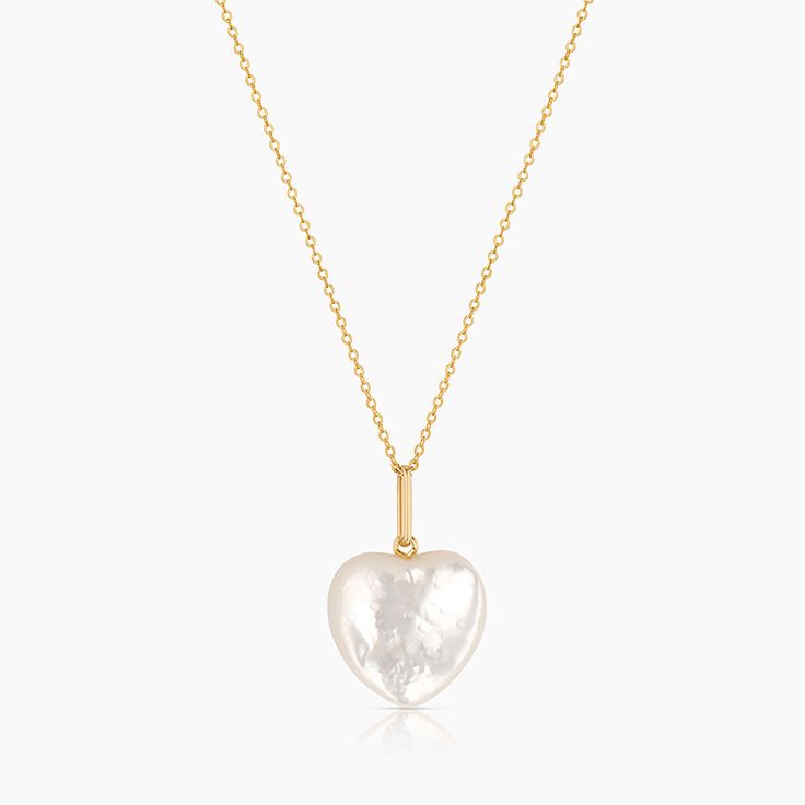 Our Gemma puffy heart in mother of pearl is an opulent shiny amulet to add a beachy flair to any look. Strung along our delicate Rae chain, it's a perfect addition for beach destinations or your everyday layers. 14k gold plated carved mother of pearl puffy heart charm on 1.2mm Rae cable chain. Adjustable between 18-20". PRODUCT NOTE : Carved stone may vary in texture, color, shape and size. These subtle differences make each piece unique. Charm measures approximately : 19mm x 17mm x 6mm Pearl Bangle Bracelet, Summer Layers, Beach Destinations, Puffy Heart Charms, Bracelets With Meaning, Pearl Bangle, Pearl Heart, Mother Of Pearl Necklace, Carved Stone