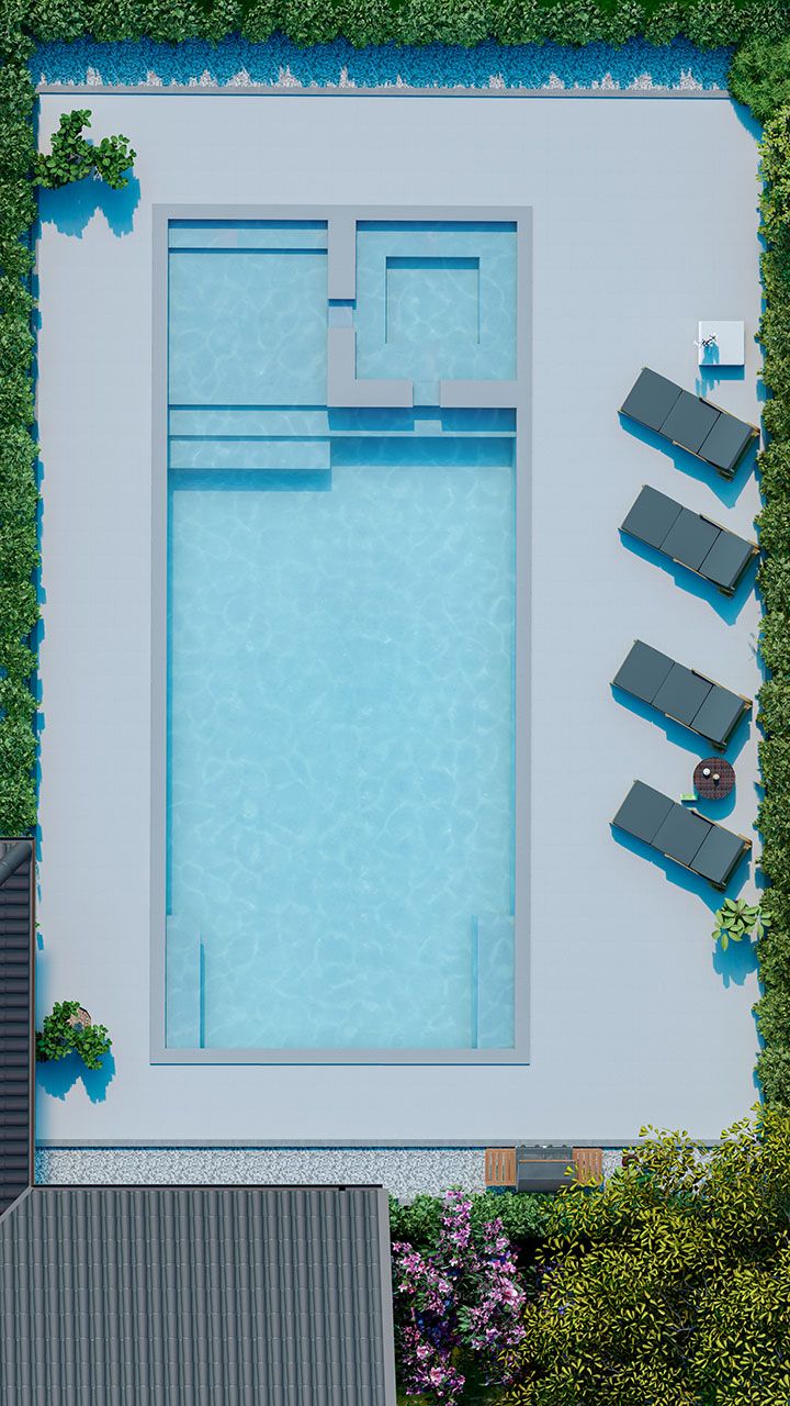 an aerial view of a swimming pool with lounge chairs and green plants on the side