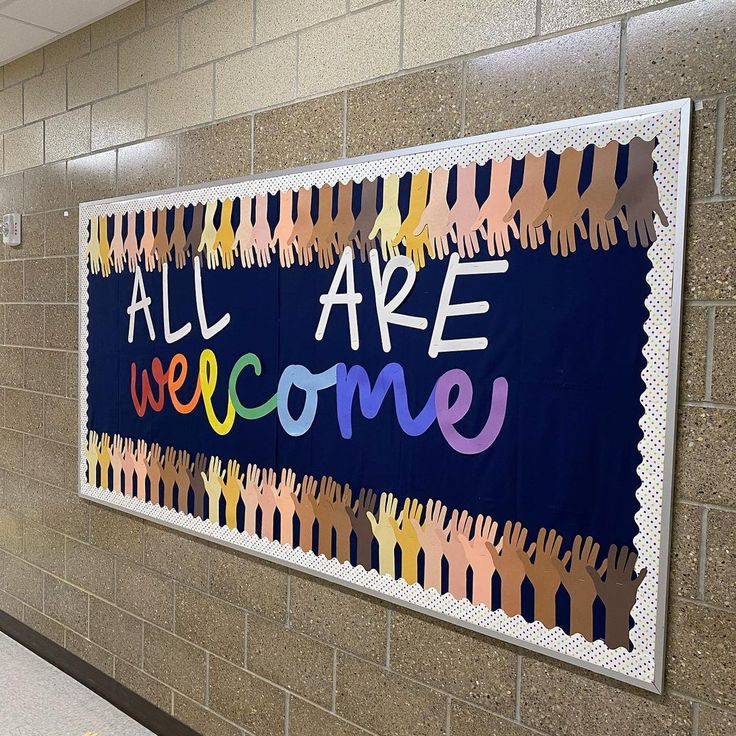 a bulletin board that says all are welcome